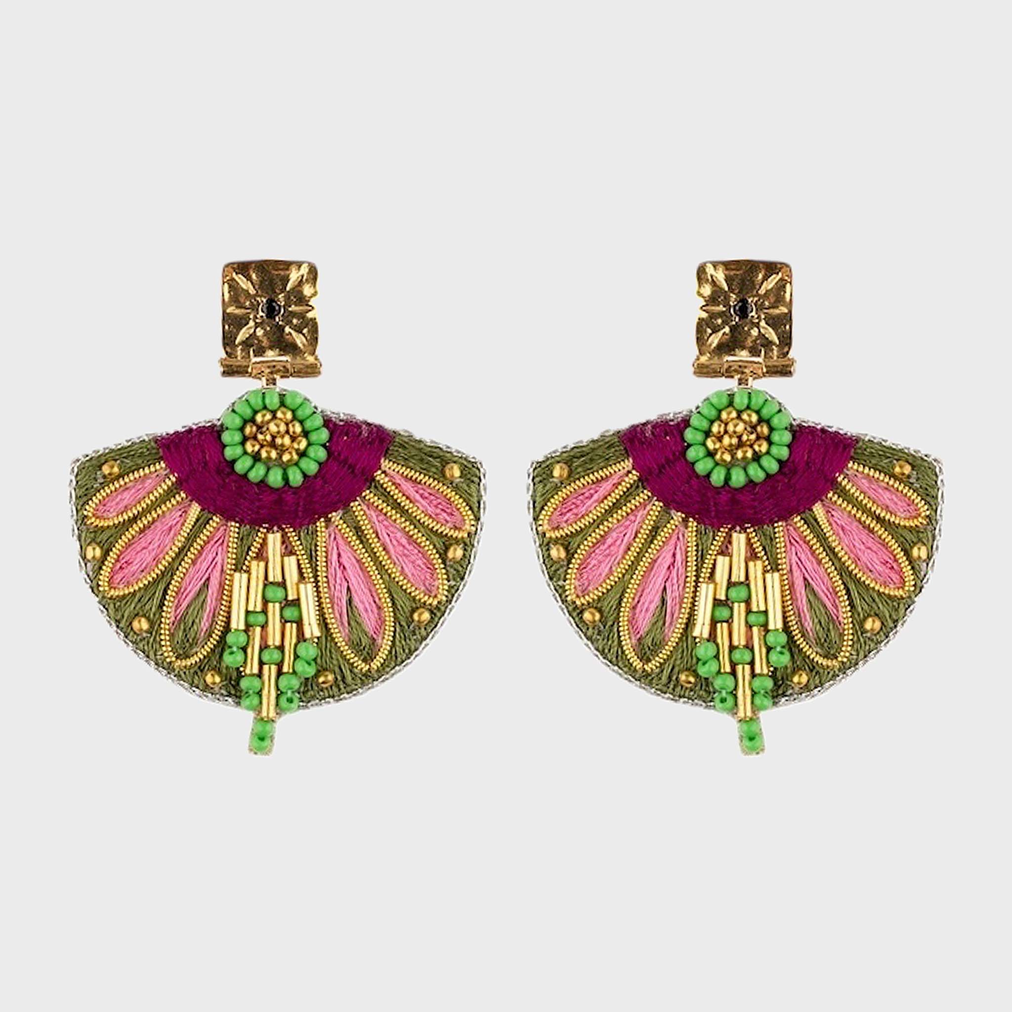 Pair of colorful earrings with gold, pink, and green details on a light gray background