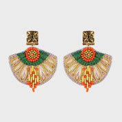 Decorative earrings with colorful design on a light gray background