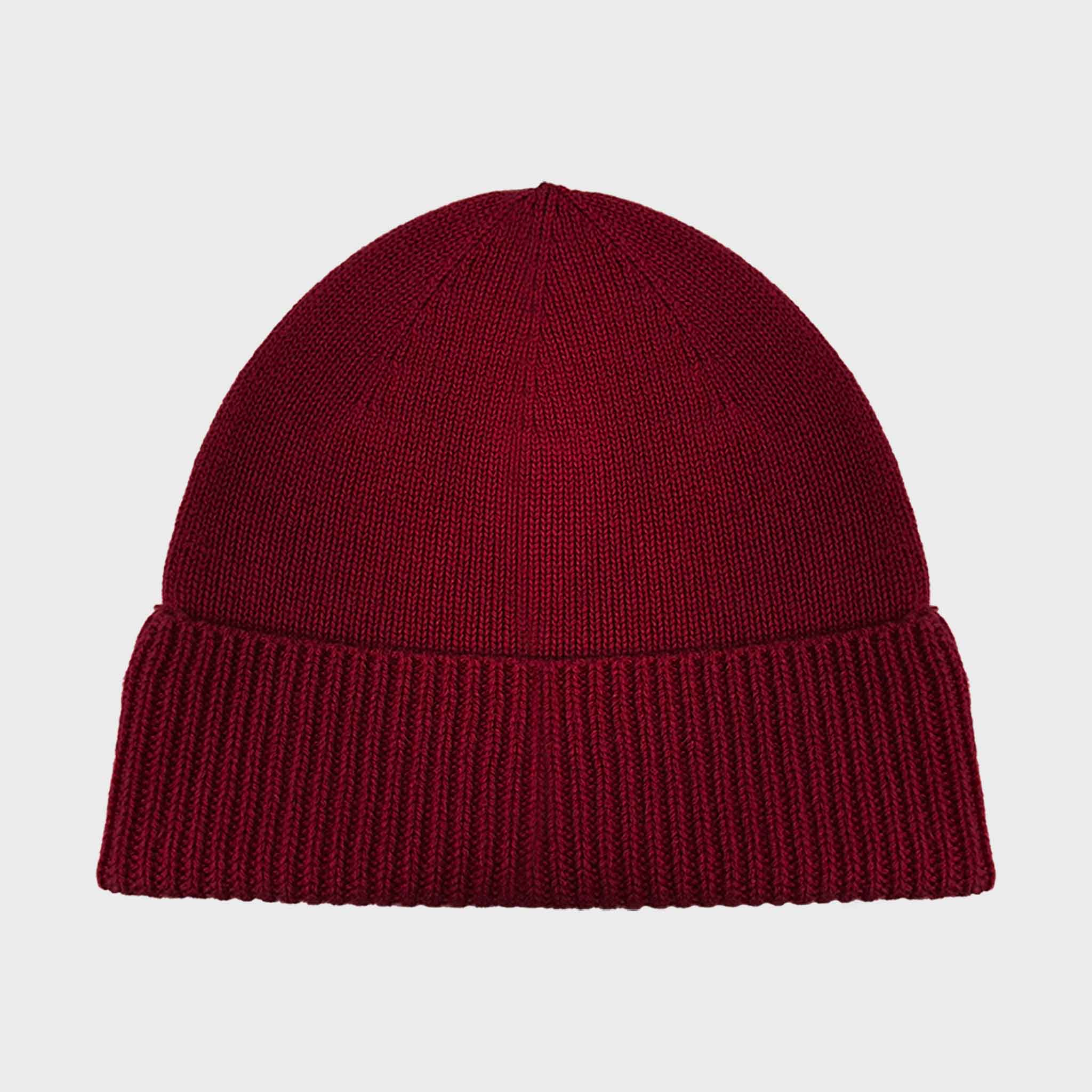 Maroon knit beanie on a light gray background