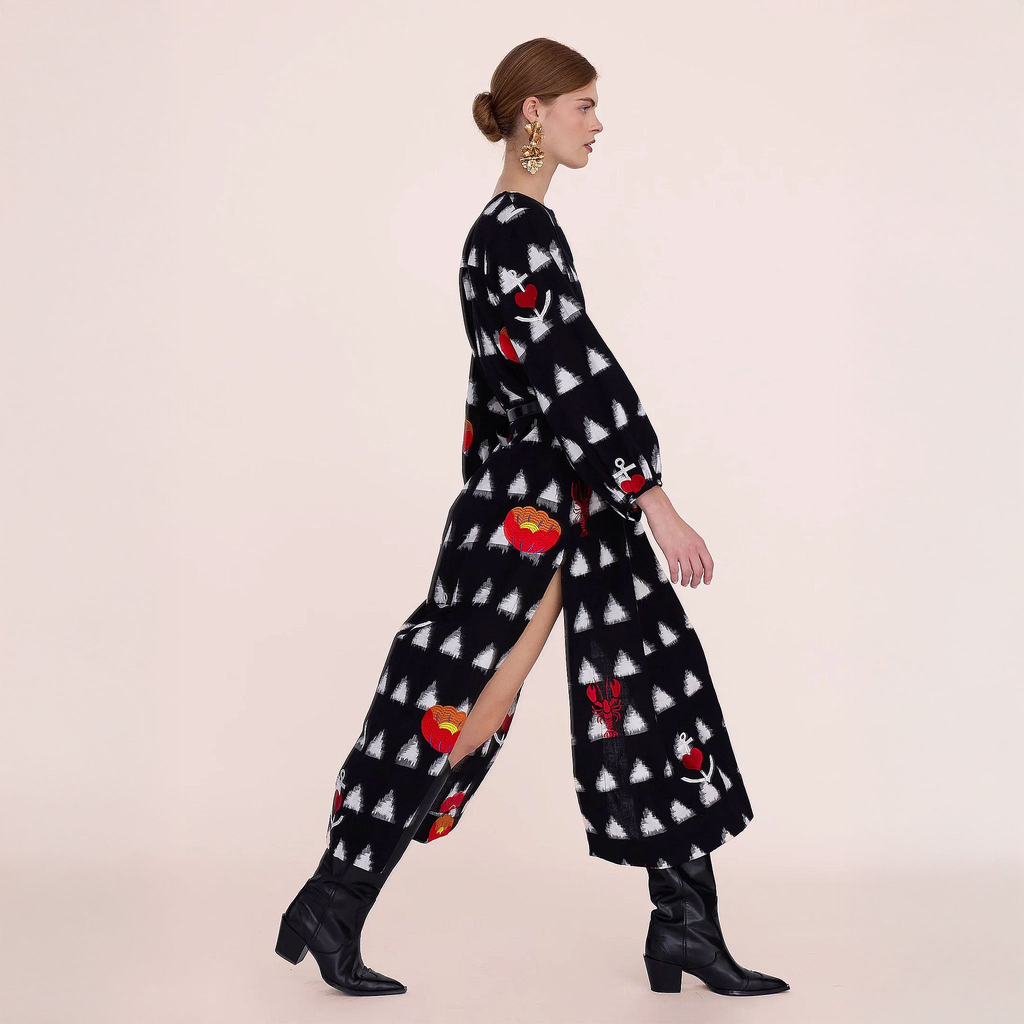 Gondi Black Kaftan side view showing the calf-length hem and side slit