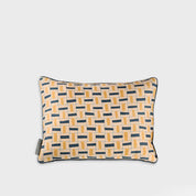Decorative pillow with geometric pattern on a light gray background