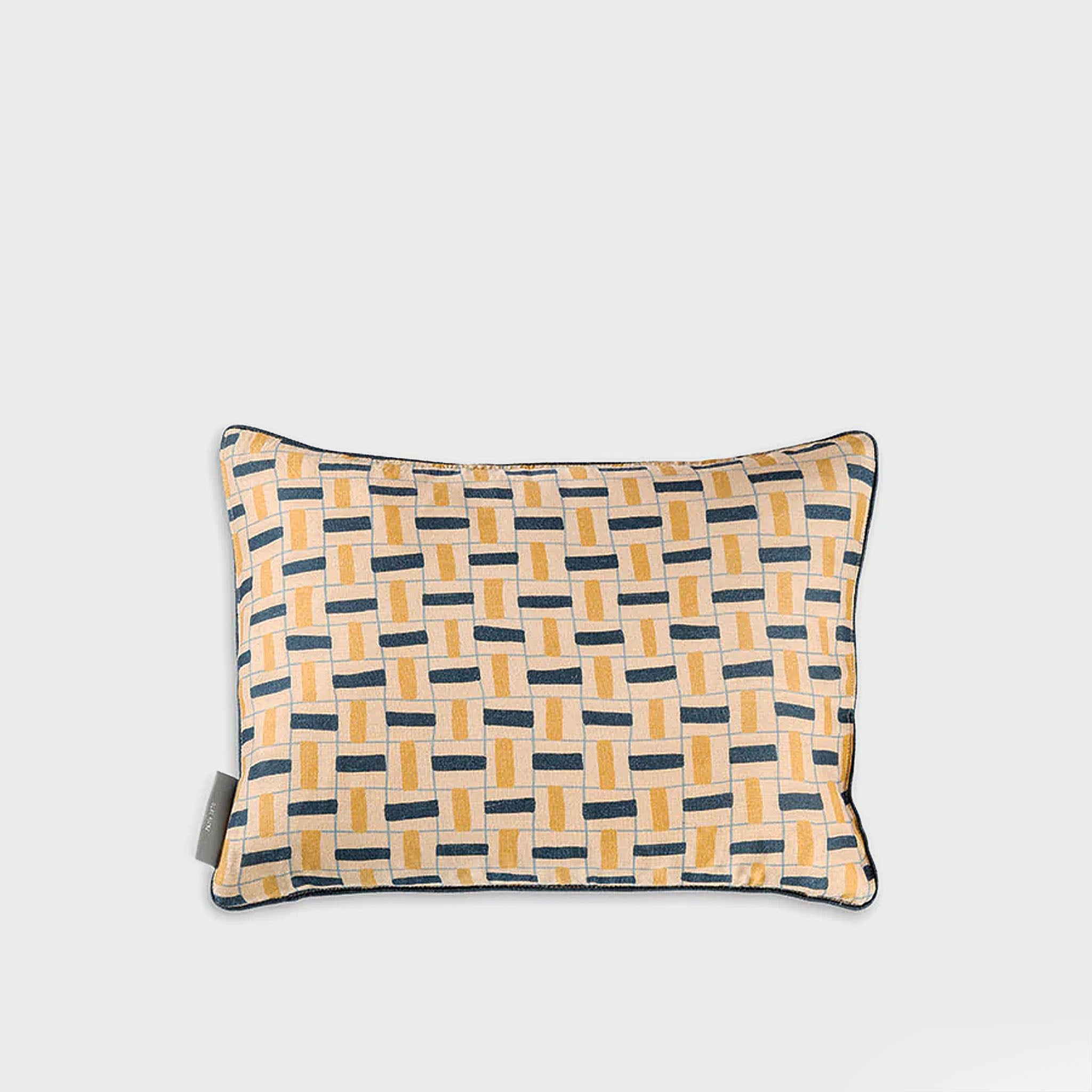 Decorative pillow with geometric pattern on a light gray background