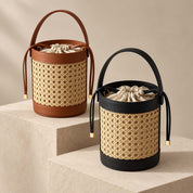 Basket Handbags in woven cane with brown and black leather trim and drawstring pouches