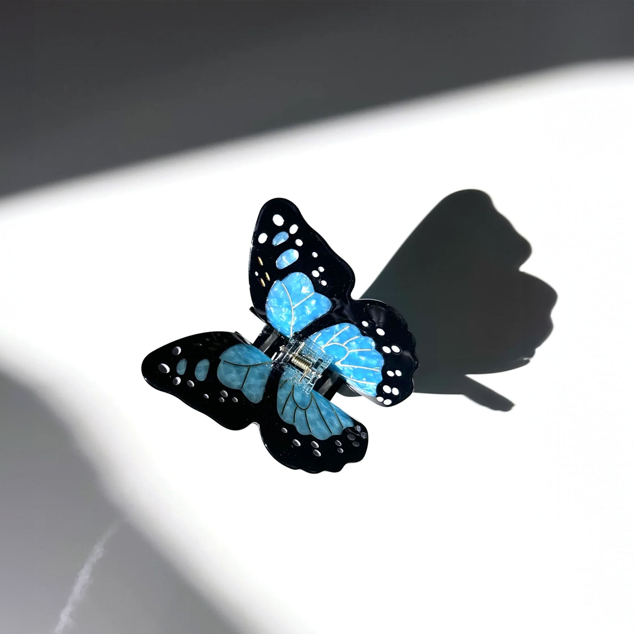 butterfly hair clip in black and blue