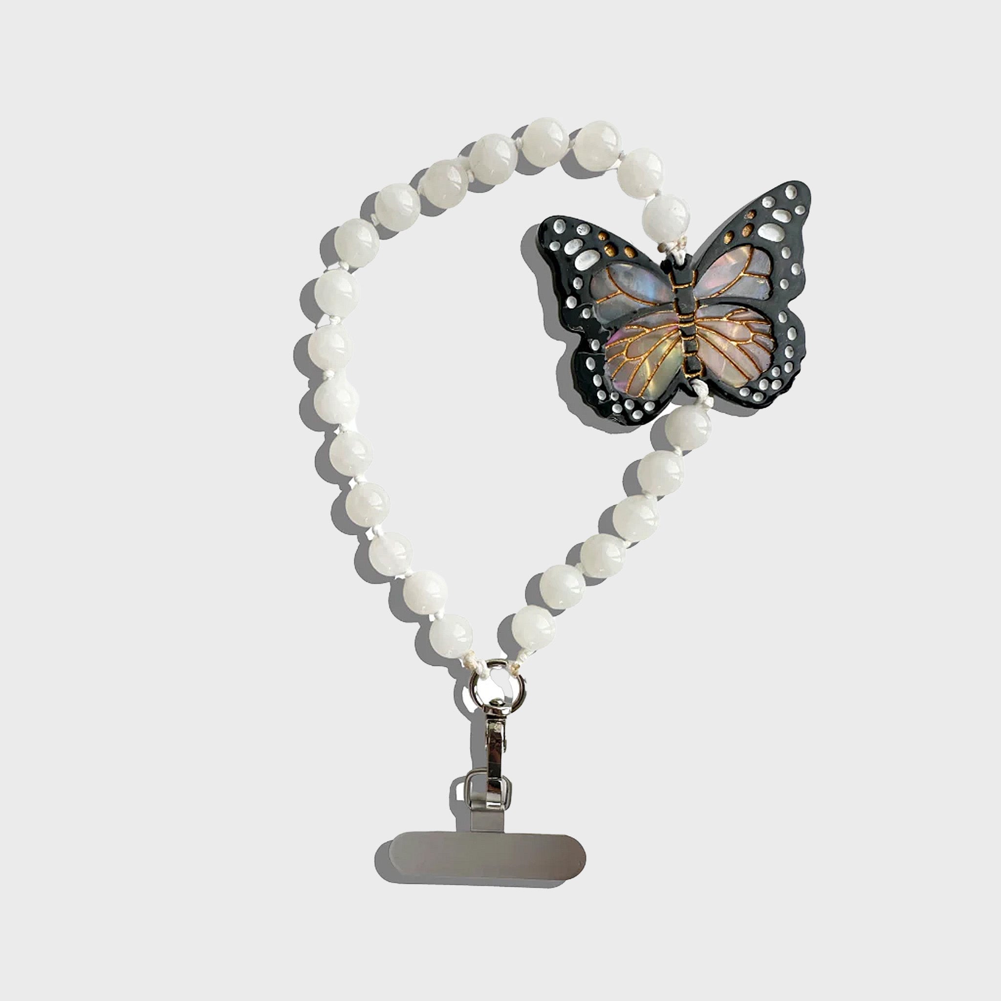 Butterfly-themed beaded lanyard on a light gray background