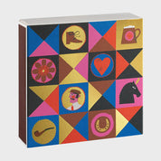 Foto de producto de la caja de fósforos Colorful Gentleman de Aura Collective: patrón geométrico de triángulos en azul, rosa, rojo, marrón y dorado con íconos de un caballero fumando pipa, una bota, un corazón, un caballo, una flor, un tarro de cerveza, una pipa y una herradura.