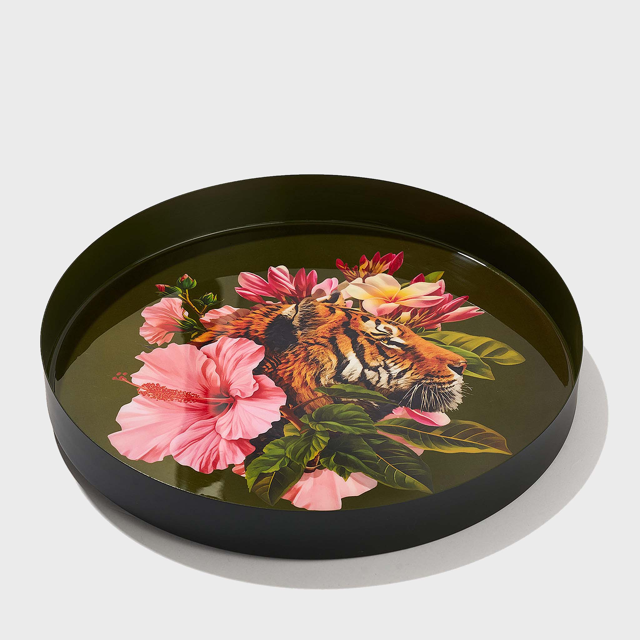 Olive green round enamel tray with tiger and pink floral artwork, angled view