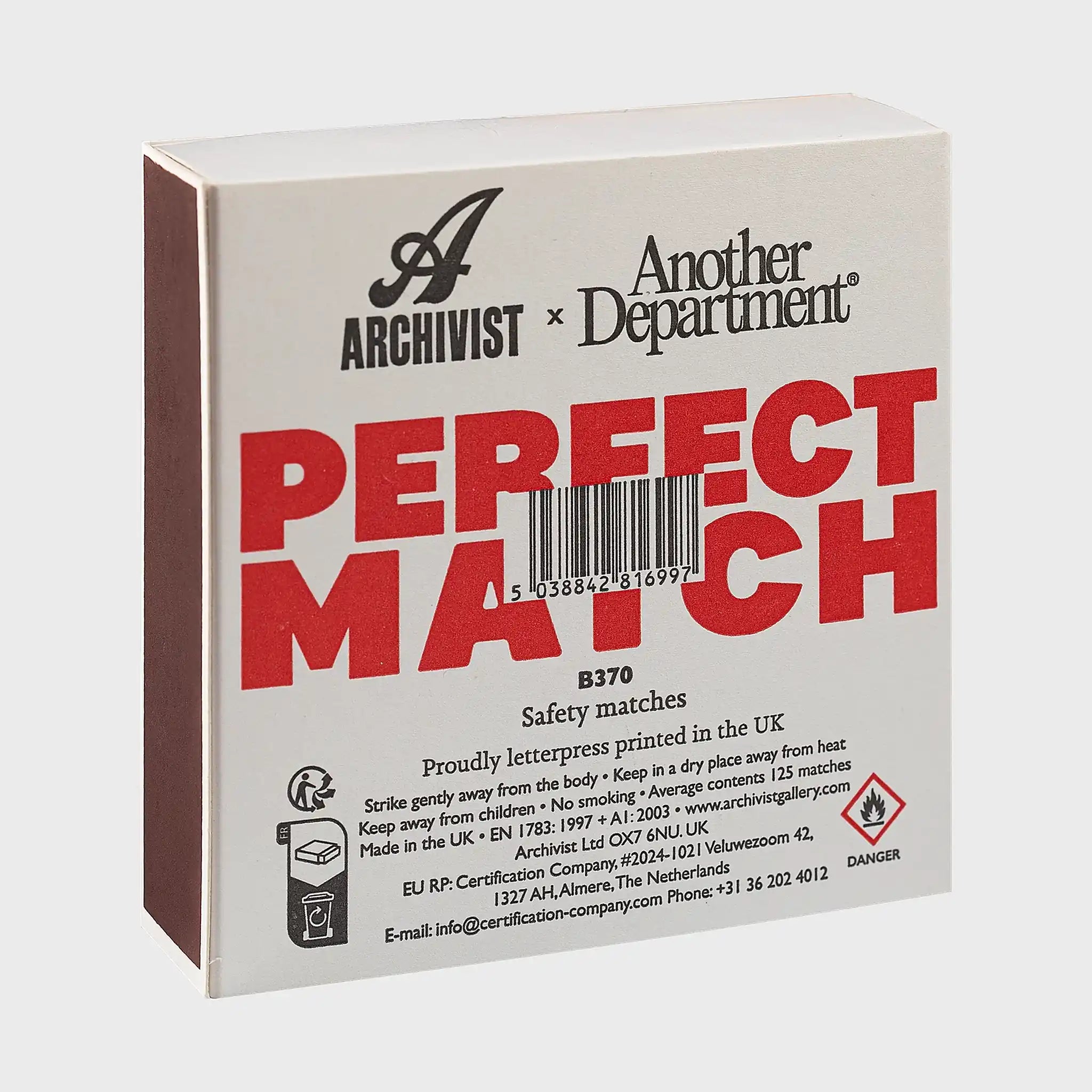 Parte trasera de la caja de fósforos Perfect Match de Aura Collective, con el logo de Archivist x Another Department, código de barras e instrucciones de seguridad.