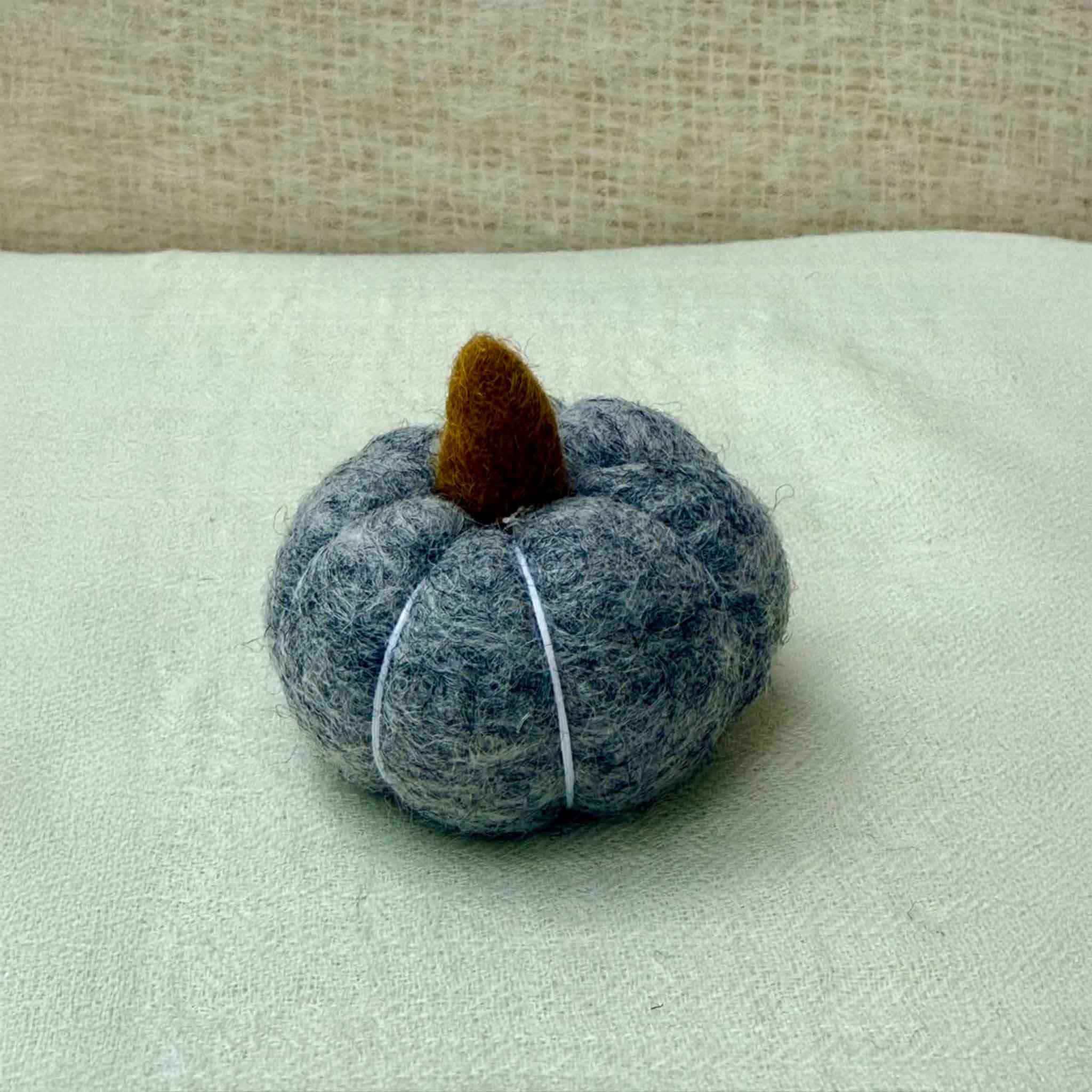 Small Wool Pumpkin in Grey wool with a curled stem
