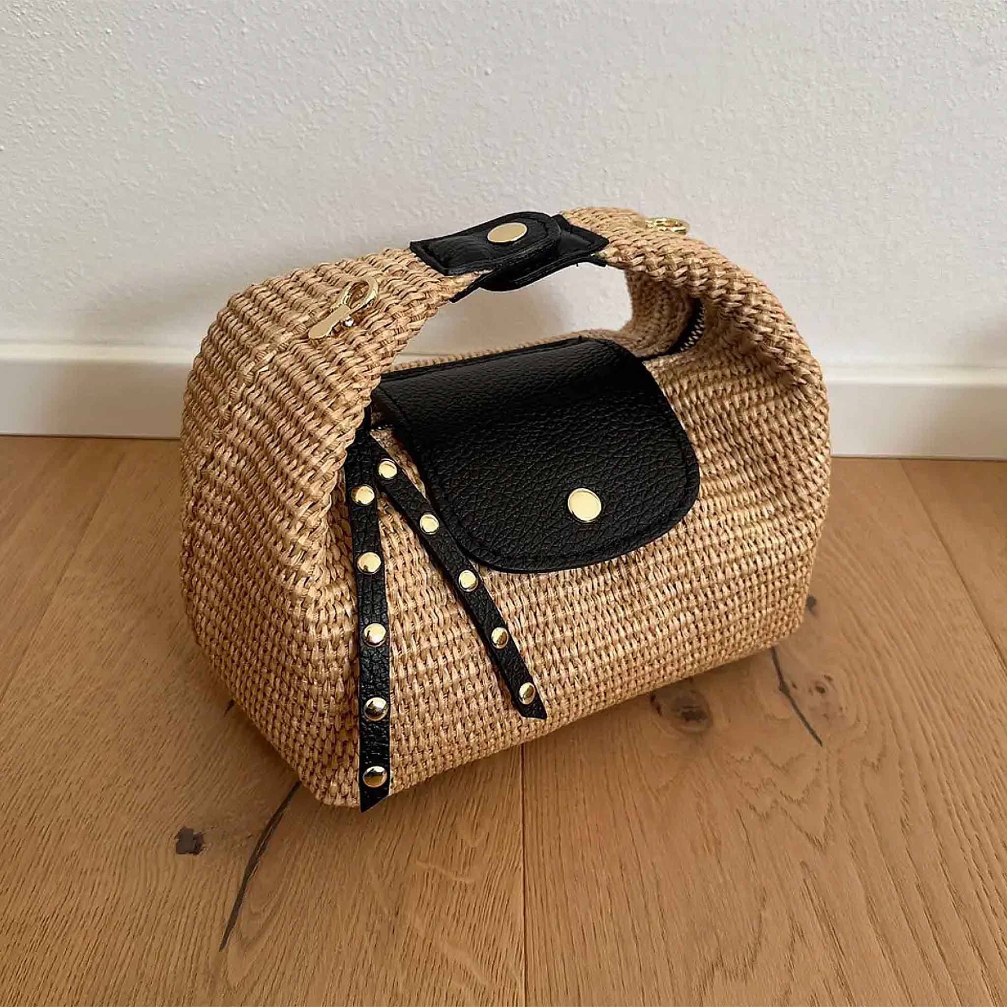 Raffia Handbag with black leather flap, studded strap and gold-tone hardware