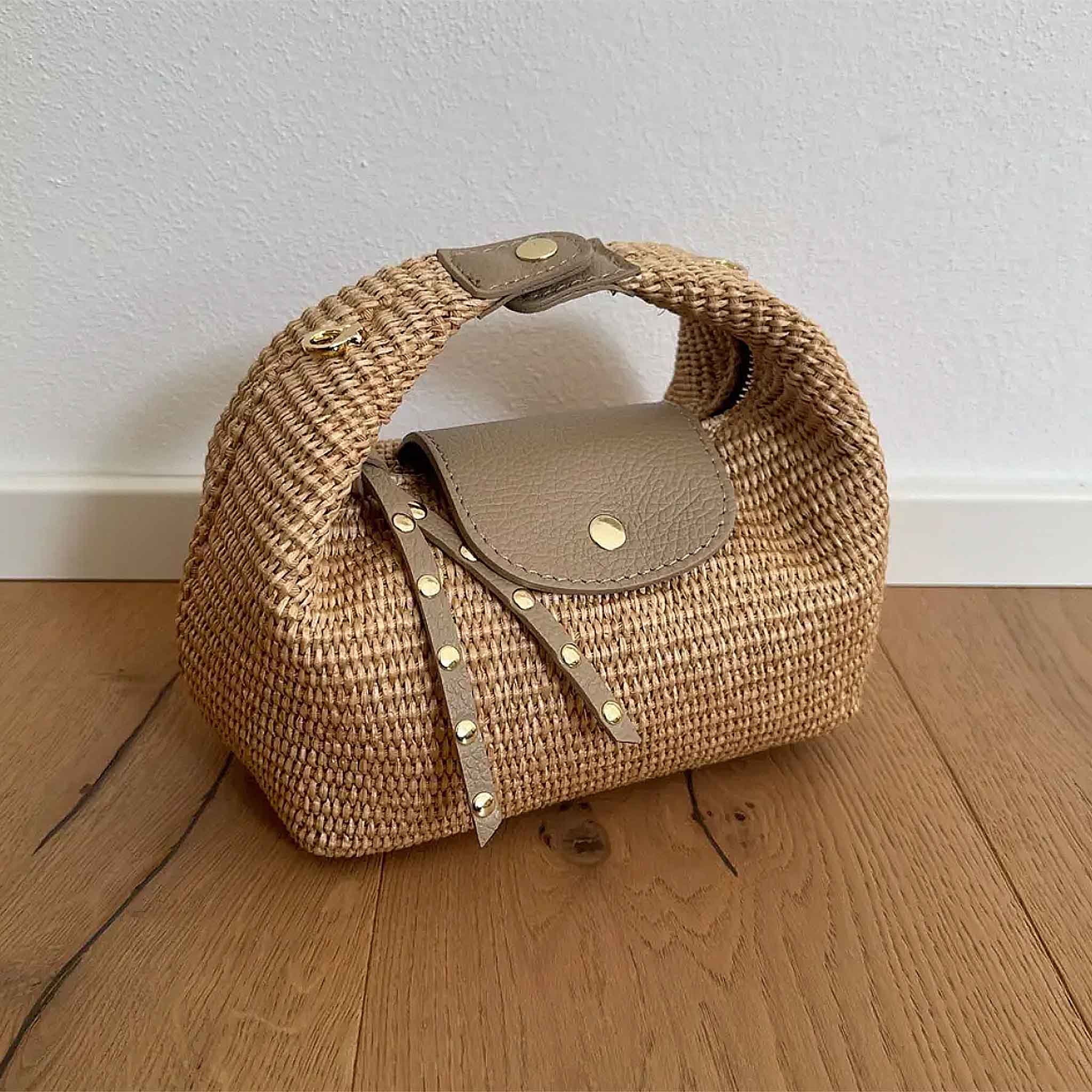 Raffia Handbag with brown leather flap, studded strap and gold-tone hardware