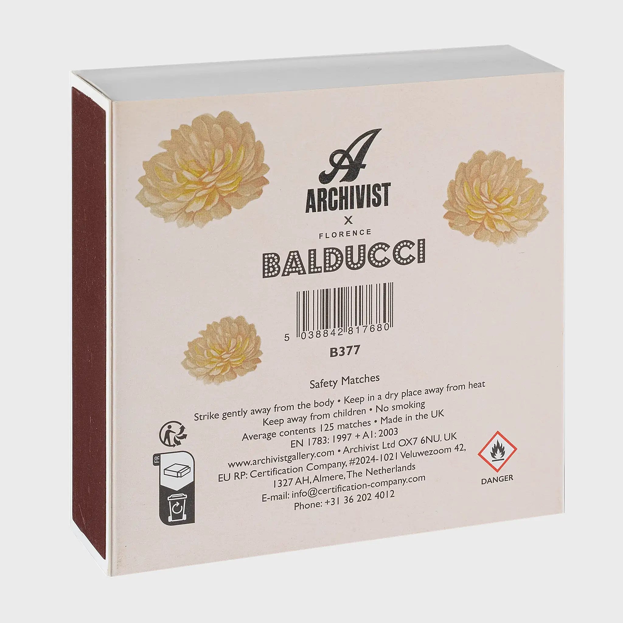 Parte trasera de la caja de fósforos Rose Perle d'Or de Aura Collective, con el logo de Archivist x Florence Balducci, dalias ilustradas y código de barras.