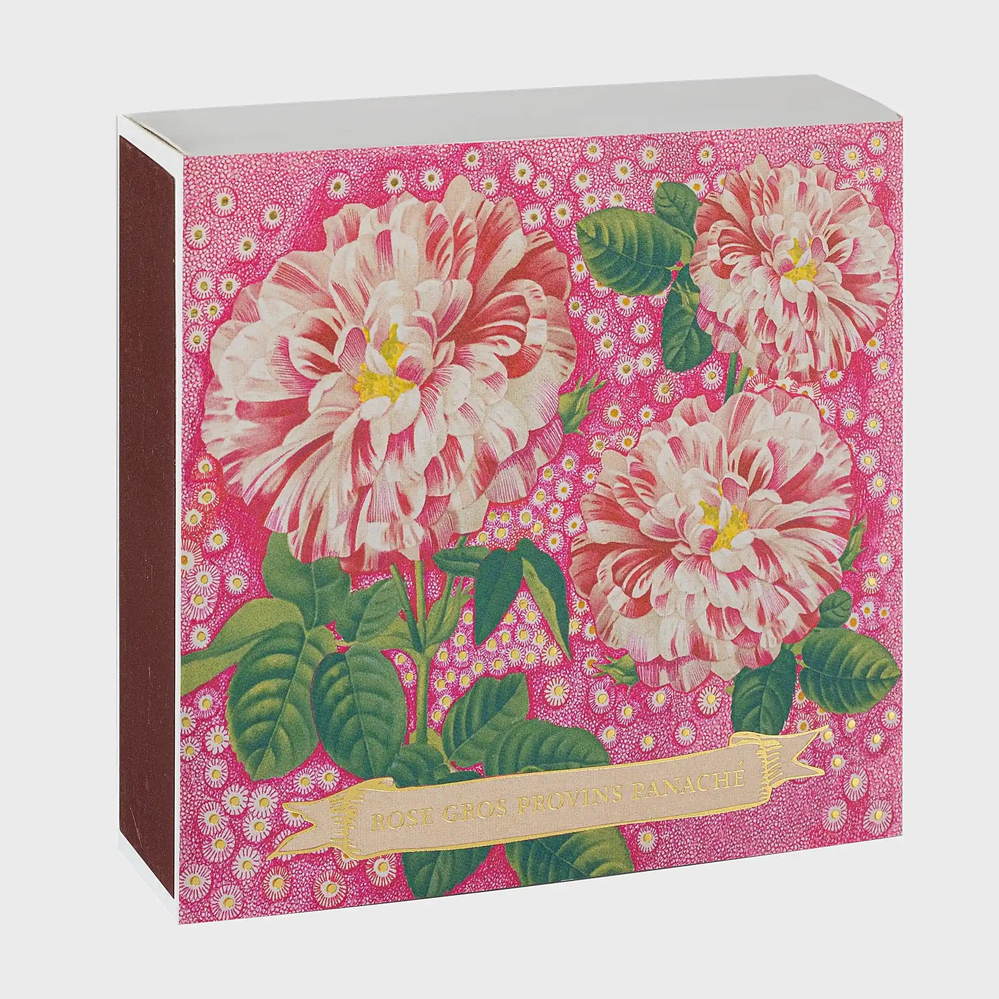 Foto de producto de la caja de fósforos Rose Provin Petunia de Aura Collective: ilustración botánica vintage de rosas rosadas y blancas jaspeadas sobre fondo fucsia con lunares dorados, con el texto Rose Gros Provins Panaché.