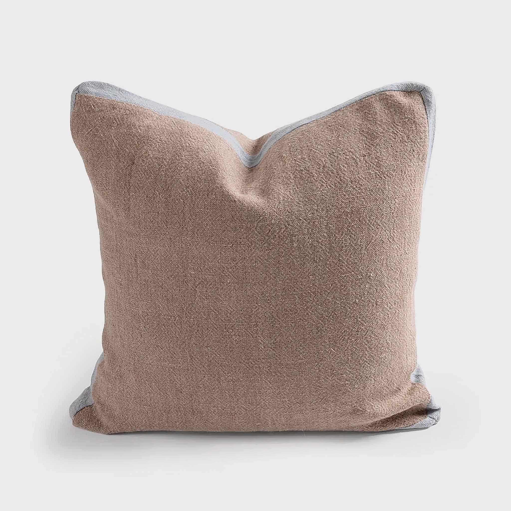 Square Jim Cushion in natural chambray linen with light blue edge, front view